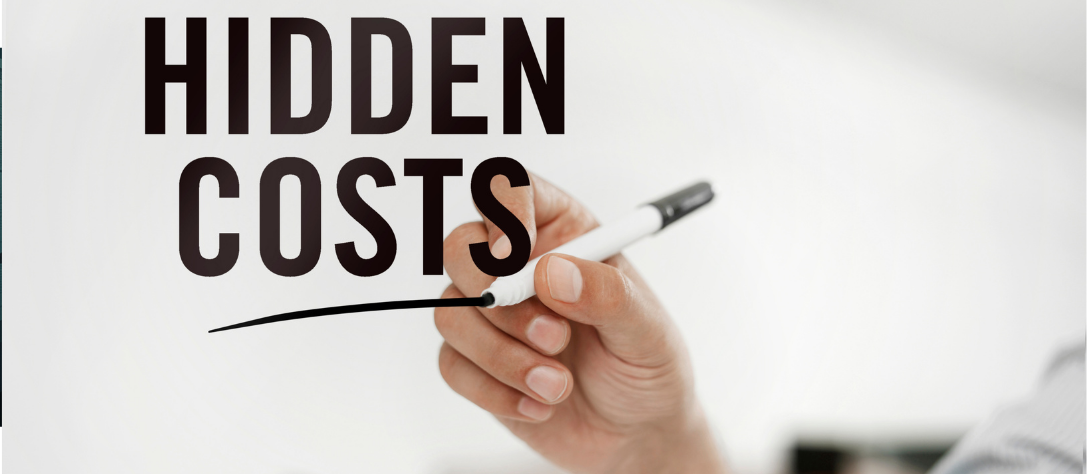 A human hand and a robotic hand work side-by-side in a modern office, manipulating glowing digital interfaces, symbolizing the concept of automation vs. augmentation.